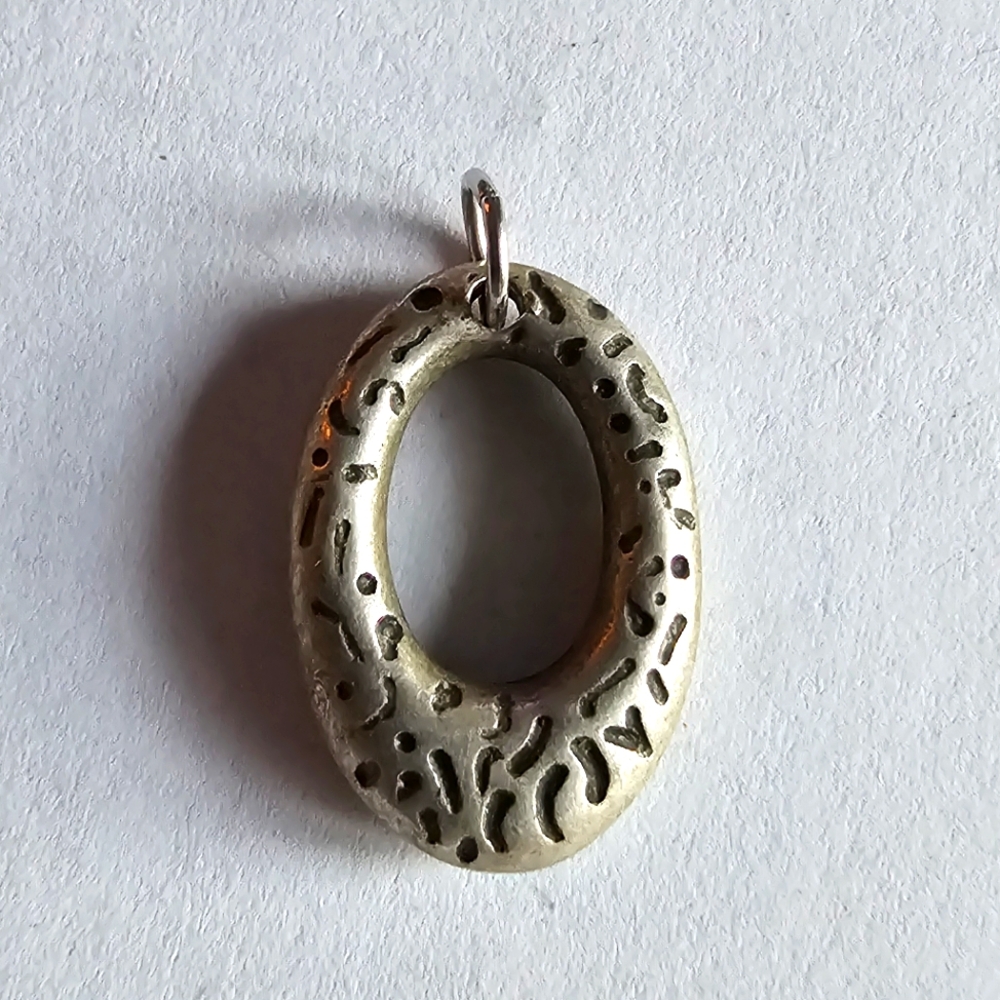 Open oval pendant silver tone charm